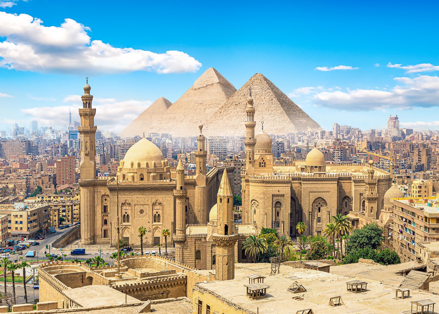 View of the Mosque Sultan Hassan in Cairo and pyramids, Egypt