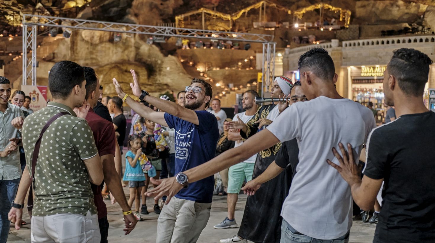 People dancing to folk music which you can enjoy on a holiday in Egypt.