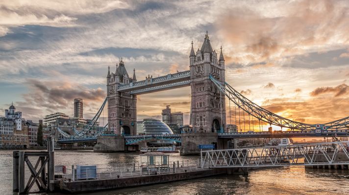 The tower bridge in England during sunset.