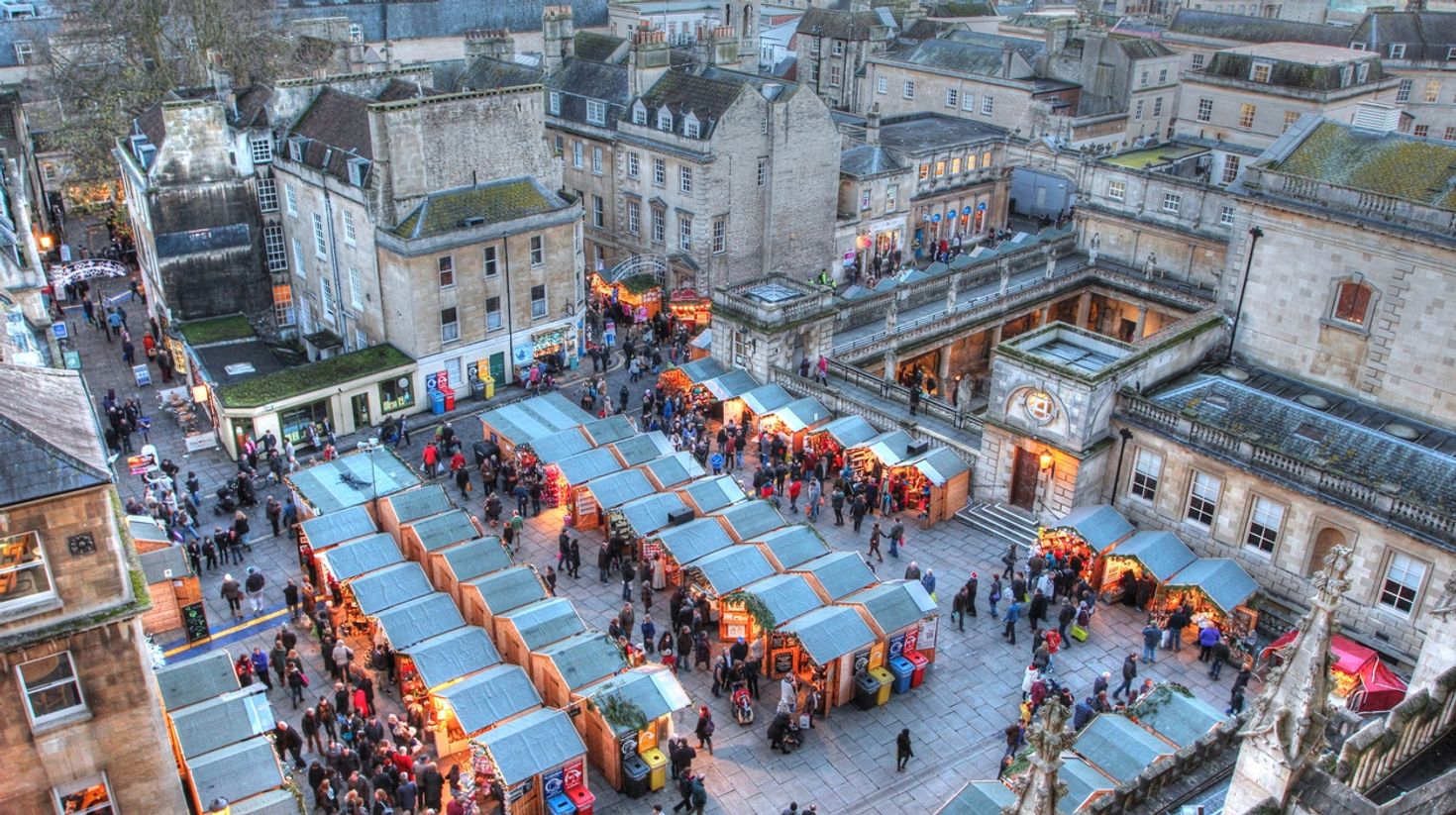 Bath Christmas market in the late afternoon in England in December.