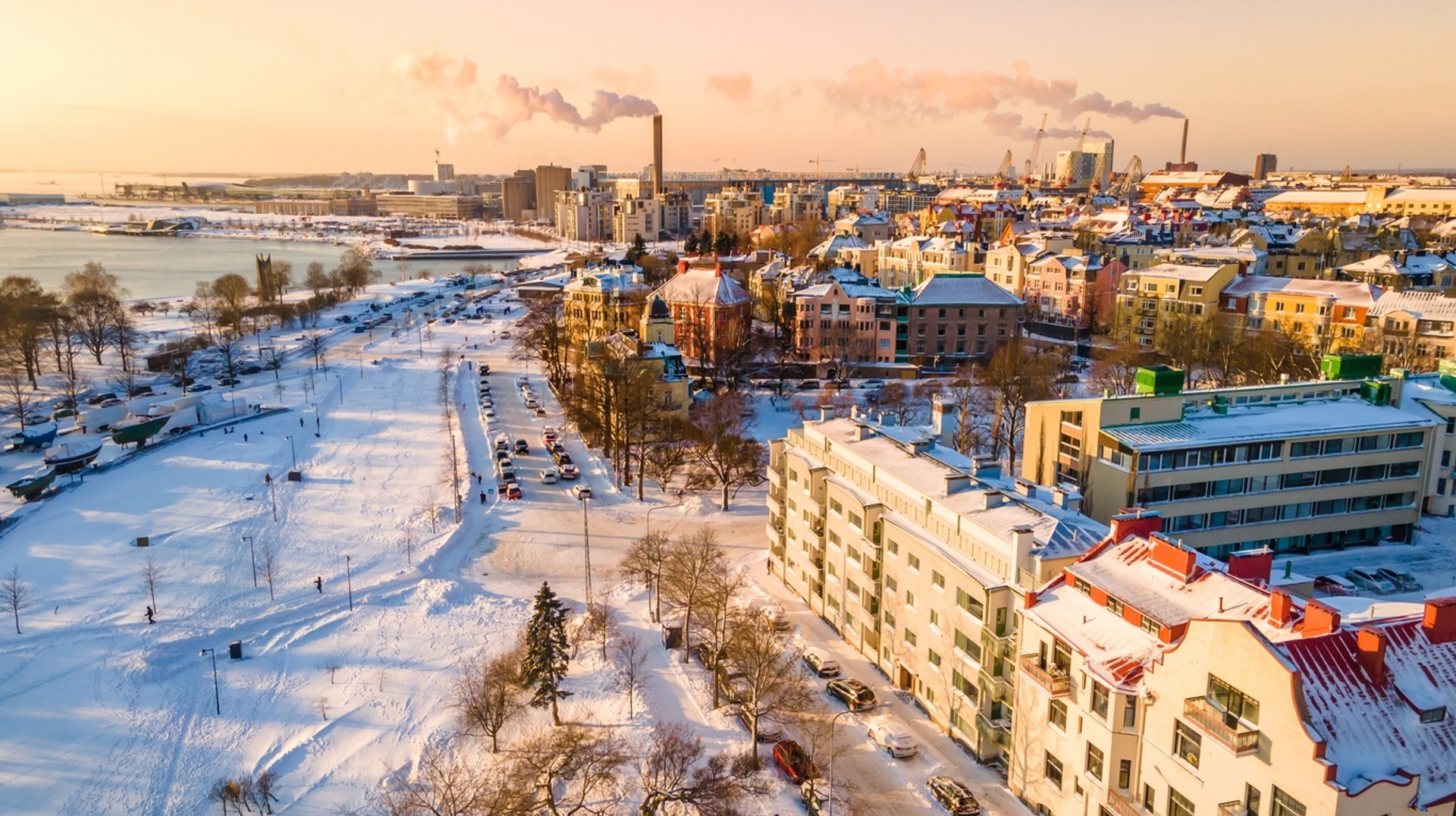 As winter arrives in Finland, the landscape adorns a white blanket of snow. Ariel shot of Helsinki, Finland in November