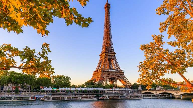 Eiffel tour in autumnal view across river Seine as seen on France tour.