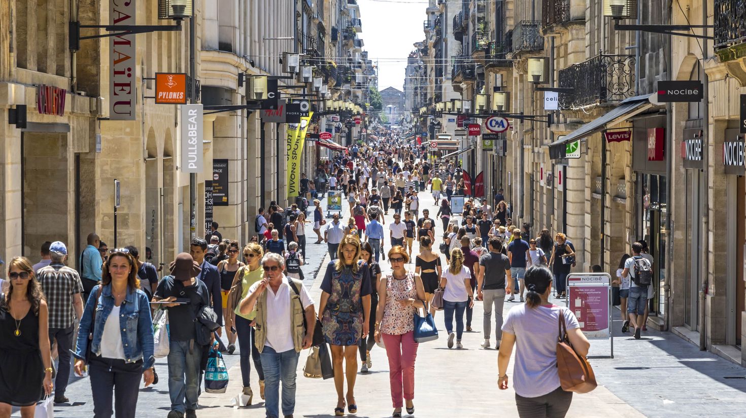 People walk on Rue Sainte Catherine in center of Bordeaux city.