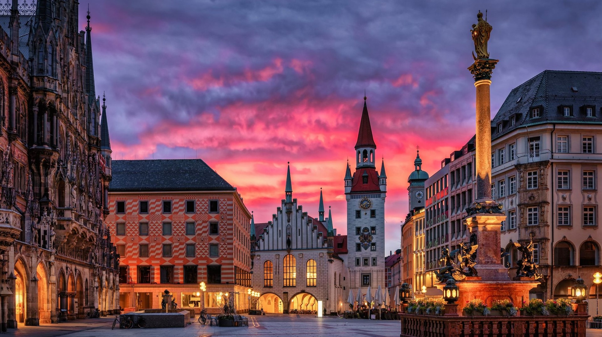 Munich's Marienplatz Square at sunrise, with the Town Hall bathed in warm, glowing light. Enjoy a sunset view of the Marienplatz Square during your 5 days in Germany.
