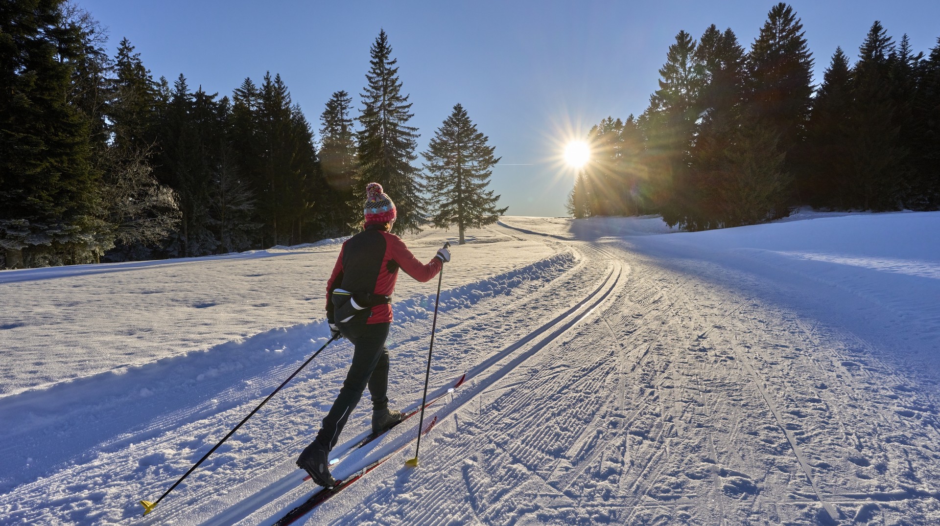 Enjoy skiing in the Alps of Germany in January. A woman skiing in the Alps in Germany in January.