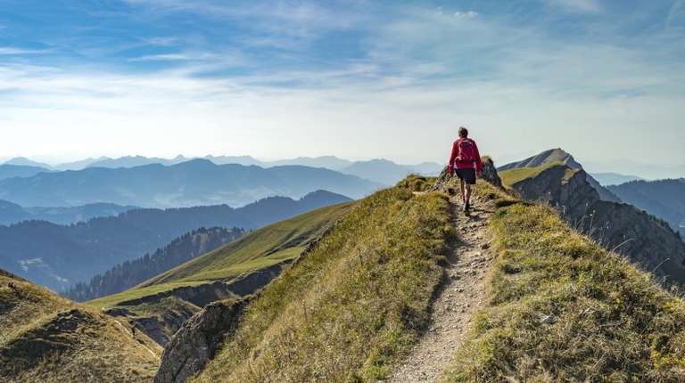 A hiker walking in Bavaria in Germany in July.