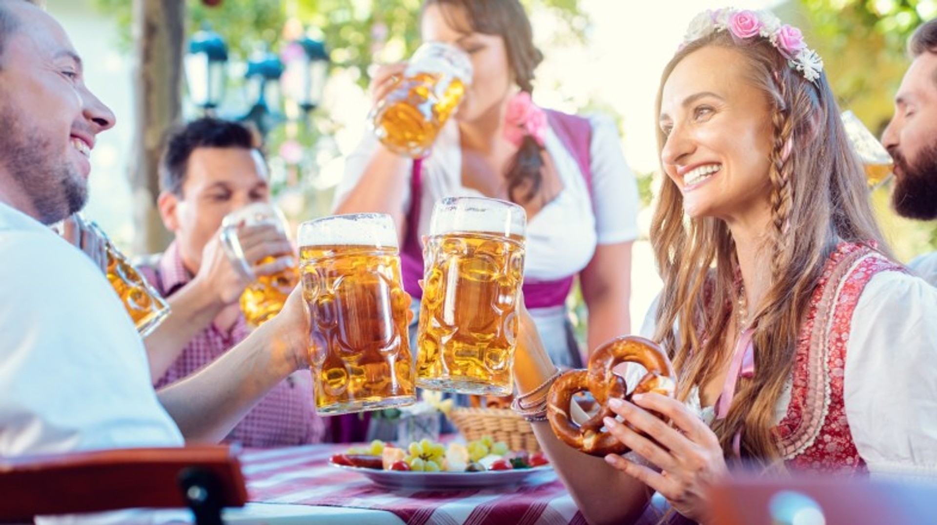 Visit Germany in October to experience Oktoberfest and traditional Bavarian culture, delicious food, and of course, plenty of beer. Oktoberfest in a Bavarian pub in Germany in October.