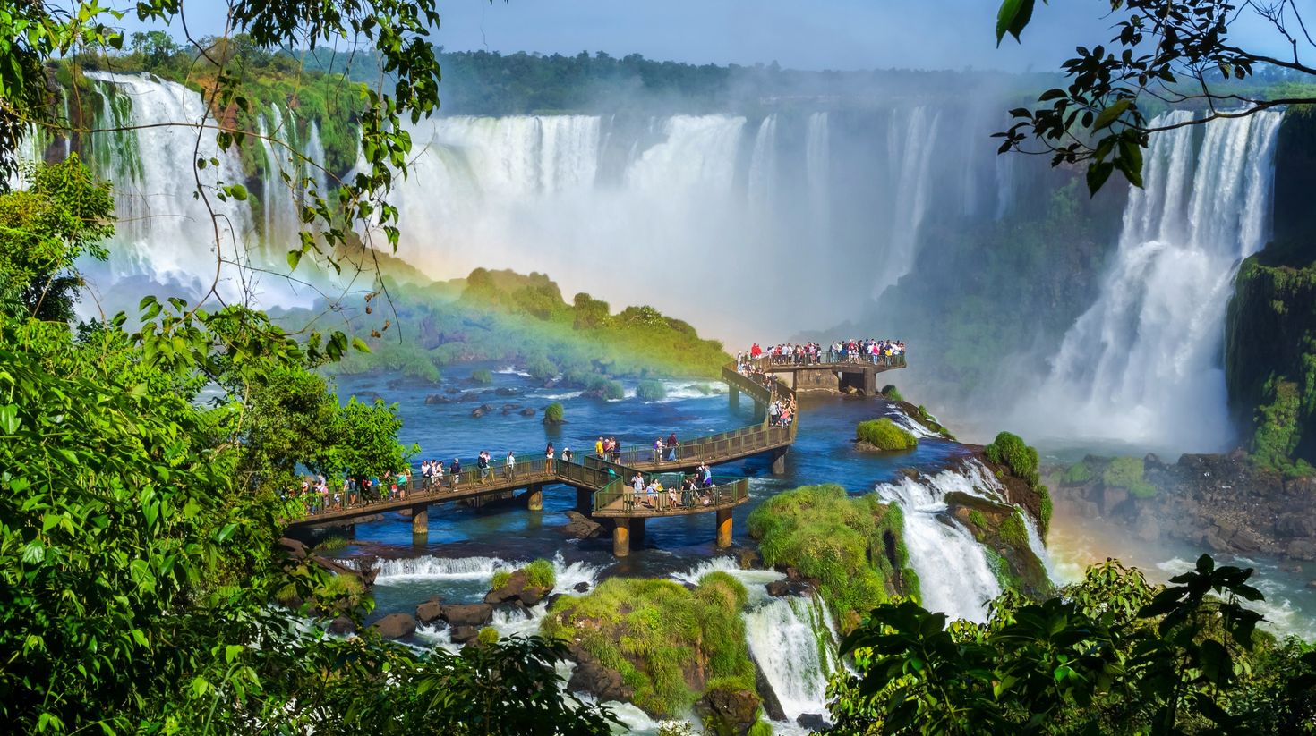 Tourists at Iguazu Falls enjoying the waterfall