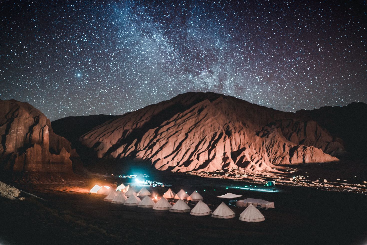 Star-studded night sky against the arid hills of Atacama