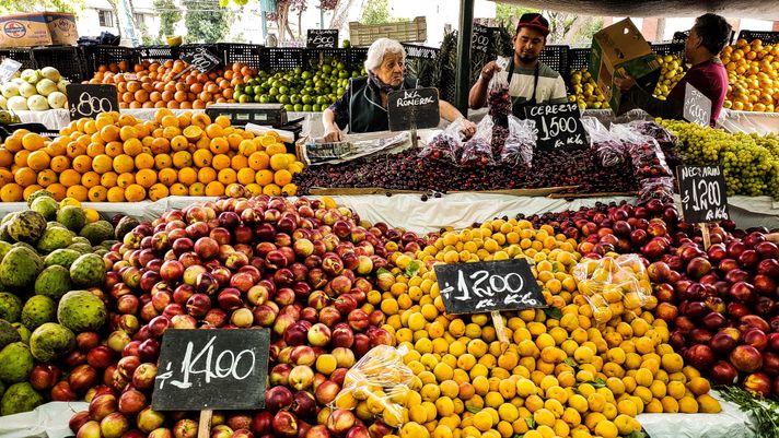An array of fruits on display in a market in Santiago