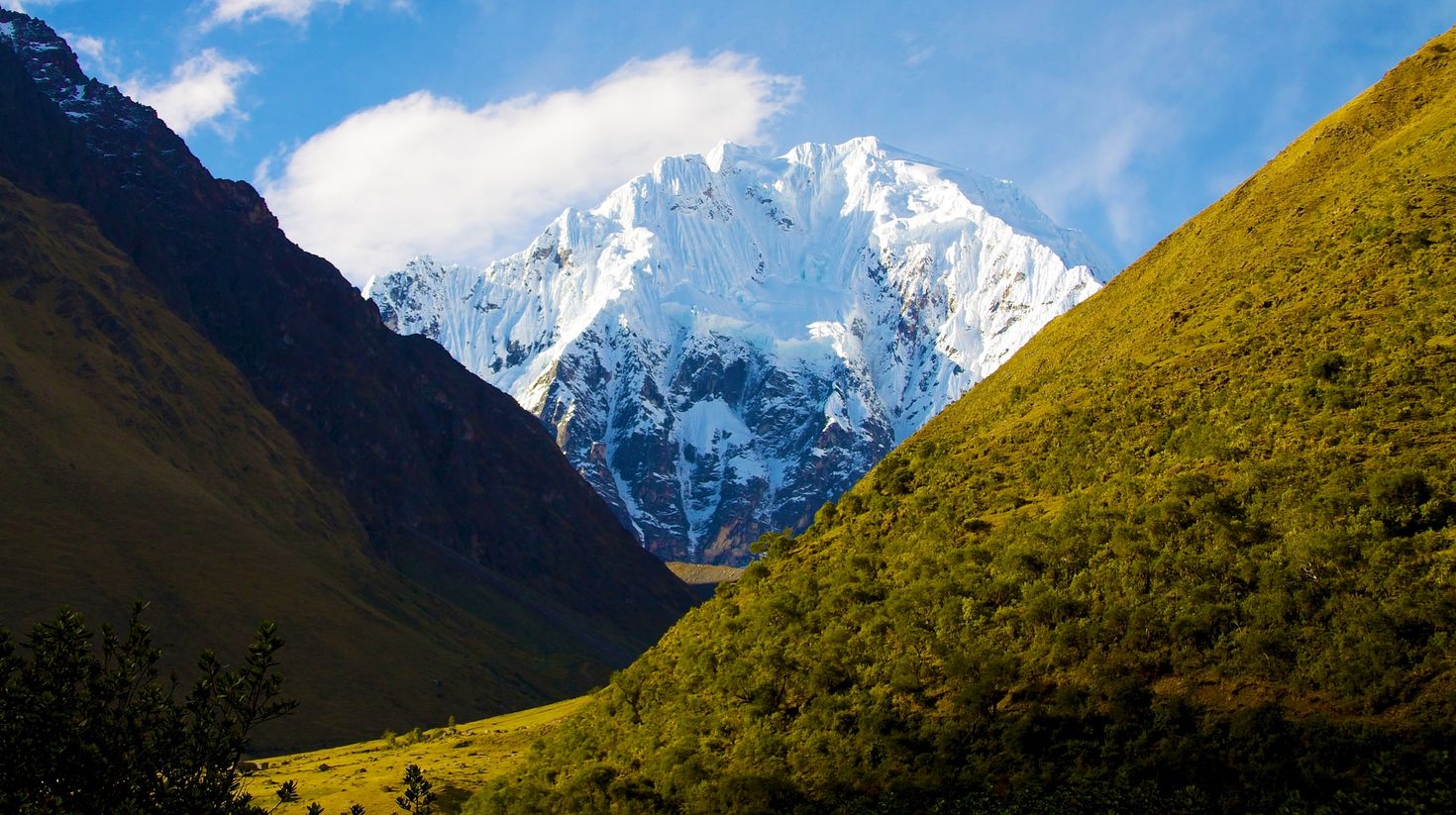 View of mountain at back with green hills in the front