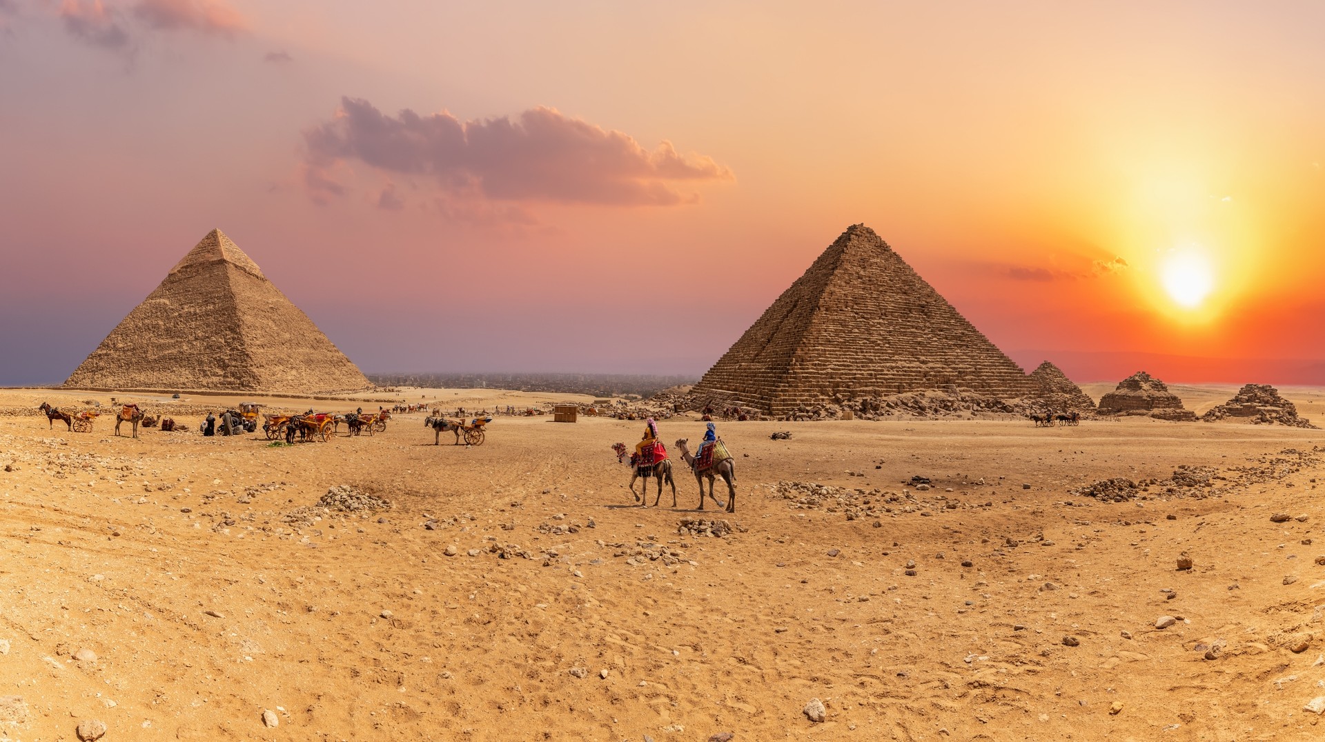 Egypt is a potpourri of ancient ruins that hark back to the dawn of history Sunset panorama of the Great Pyramids of Giza, Egypt