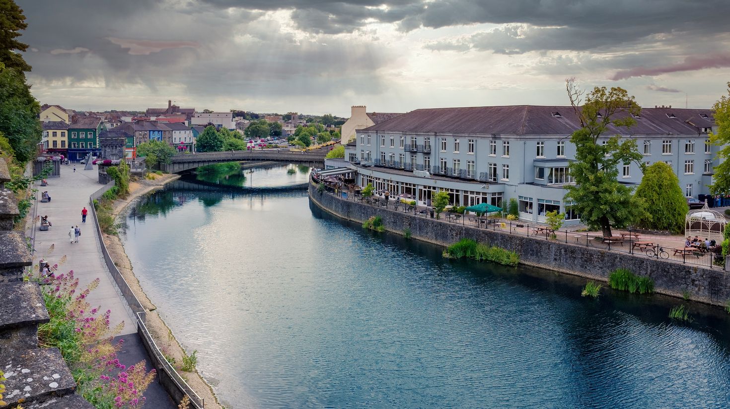 Cityscape of the medieval Kilkenny at sunset with River Nore
