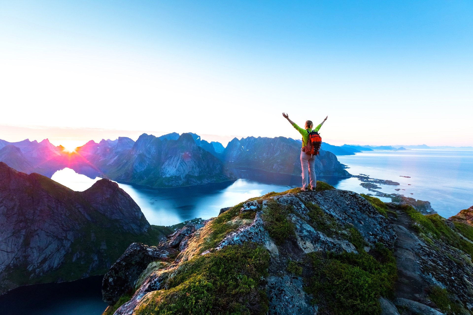 Enjoy a scenic display of nature on top of Reinebringen in the Lofoten archipelago The sunrise at the top of Reinebringen, how many days to spend in Norway.