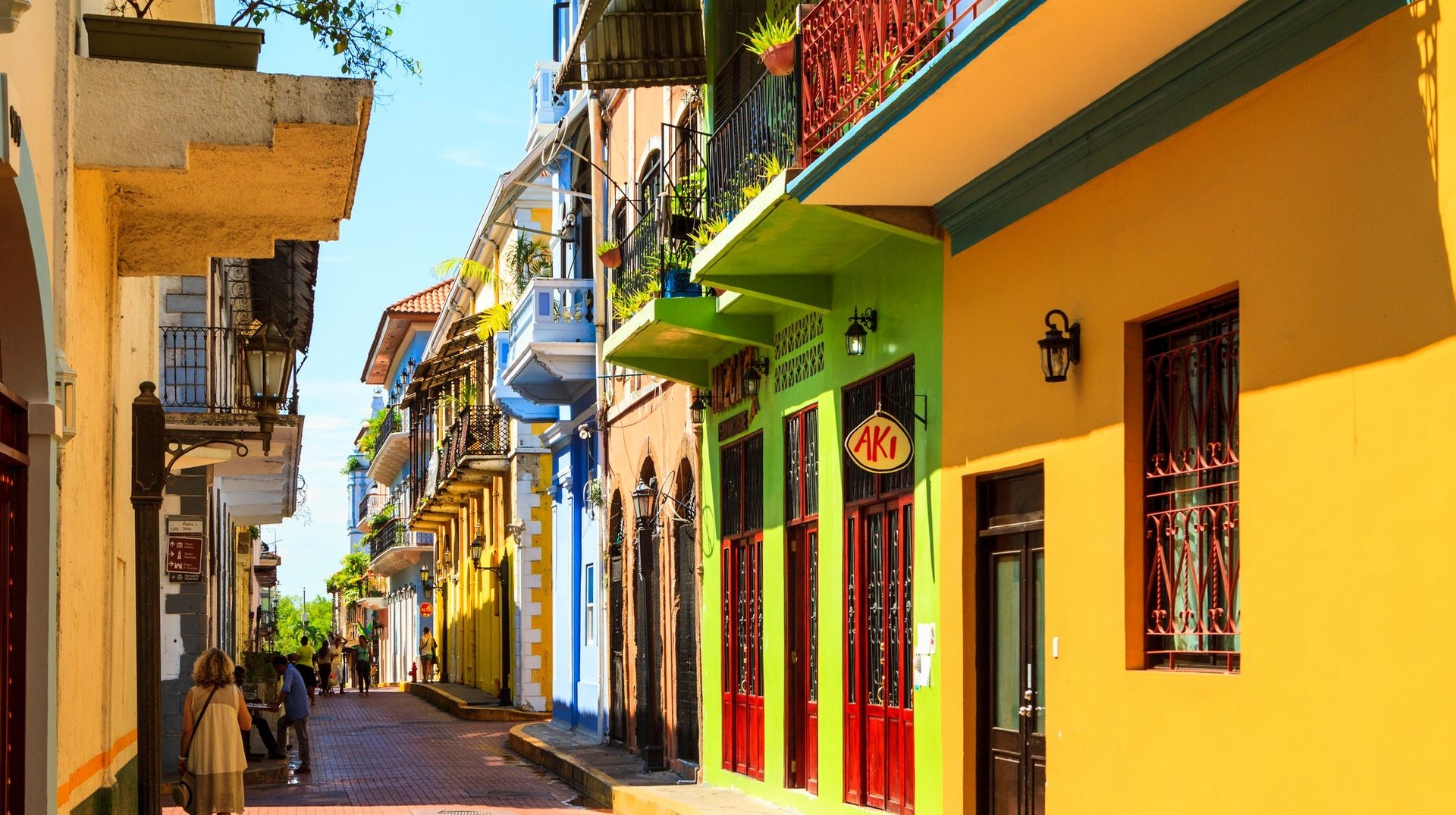 Colorful colonial-style buildings lining a narrow street in Casco Viejo