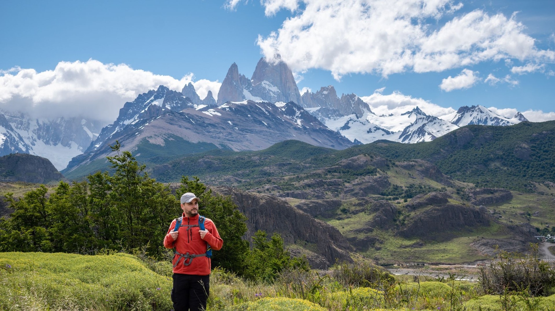 Still figuring out how long to stay in Patagonia? Discover why even a lifetime might not be enough to soak in its epic landscapes and adventures! A happy tourist on the way to Fitz Roy on a clear day; how long to stay in Patagonia.