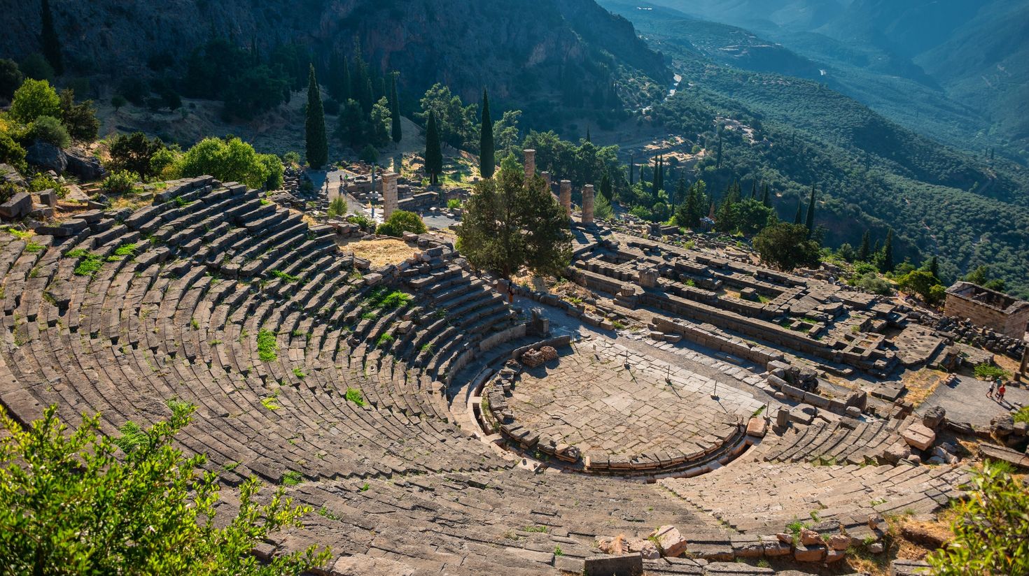 Ancient theatre of Delphi with temple of Apollo in Greece