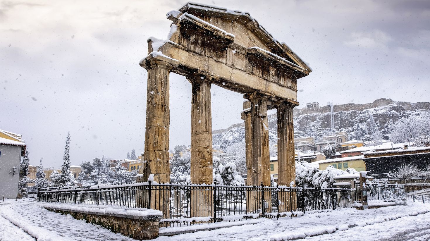 Gate of Athena underneath the Acropolis of Athens under thick snow