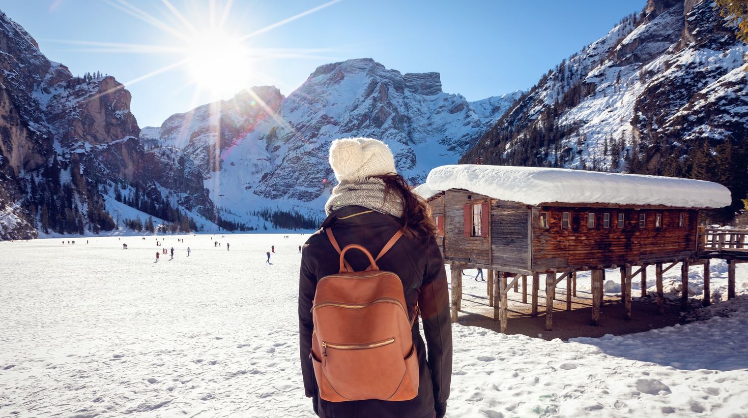 A female tourist enjoys the view of the snow covered Greece
