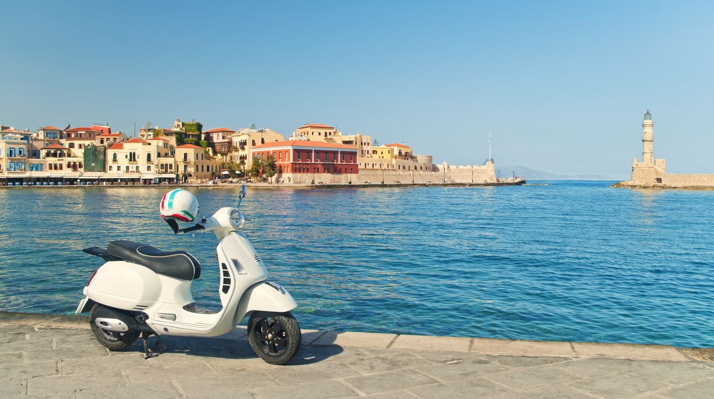Travel image of retro scooter in old greek town