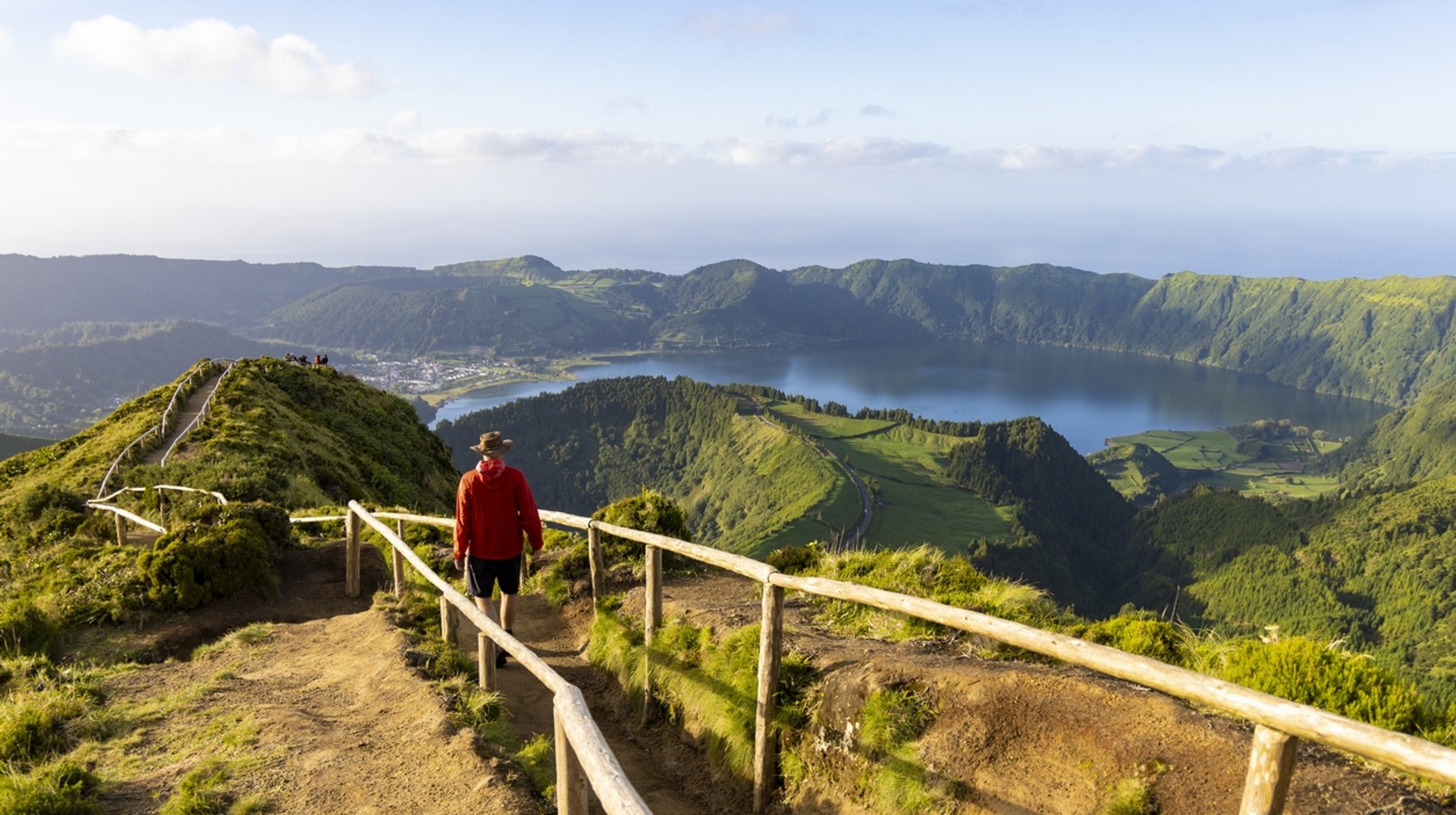 Sete Citades is a village in São Miguel Island, known for its excellent walking trails and beautiful twin lakes. A hiker in red jacket in the Sete Citades