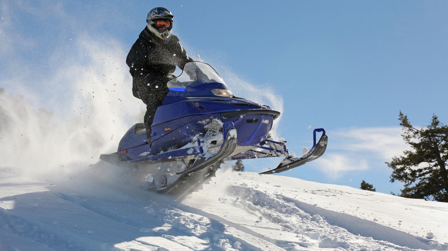 An adventurer enjoying snowmobile action in Langjokull.