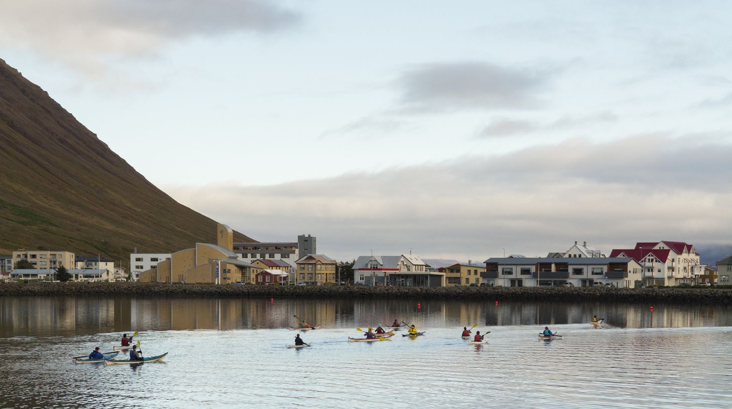 Tourists kayaking in Isafjardardjup of the Westfjords during August.
