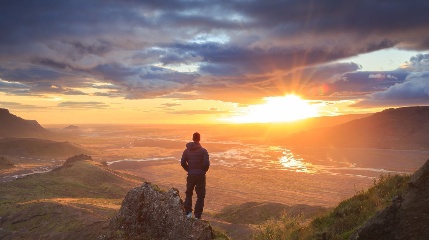 Tourist hiking the Thorsmork Valley of Iceland in July.