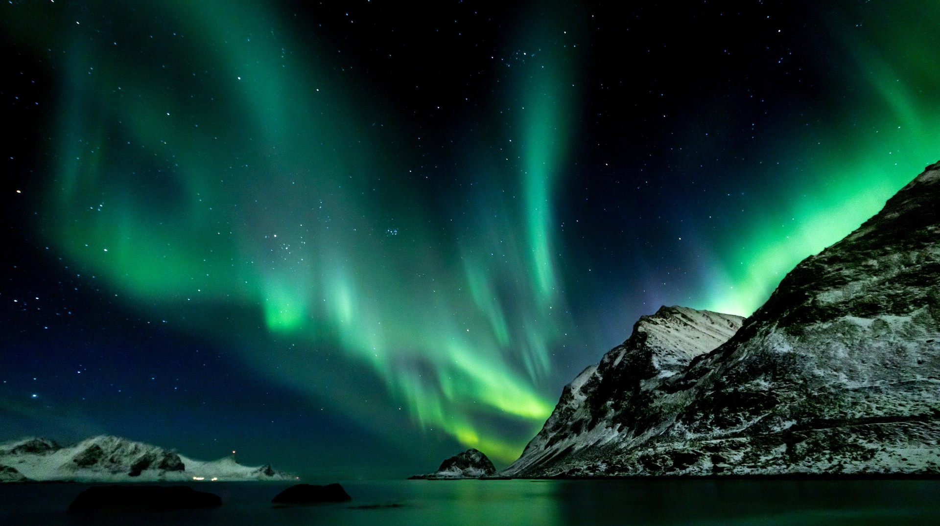 Spectacular neon green Northern Lights; the highlight of Iceland in winter.
