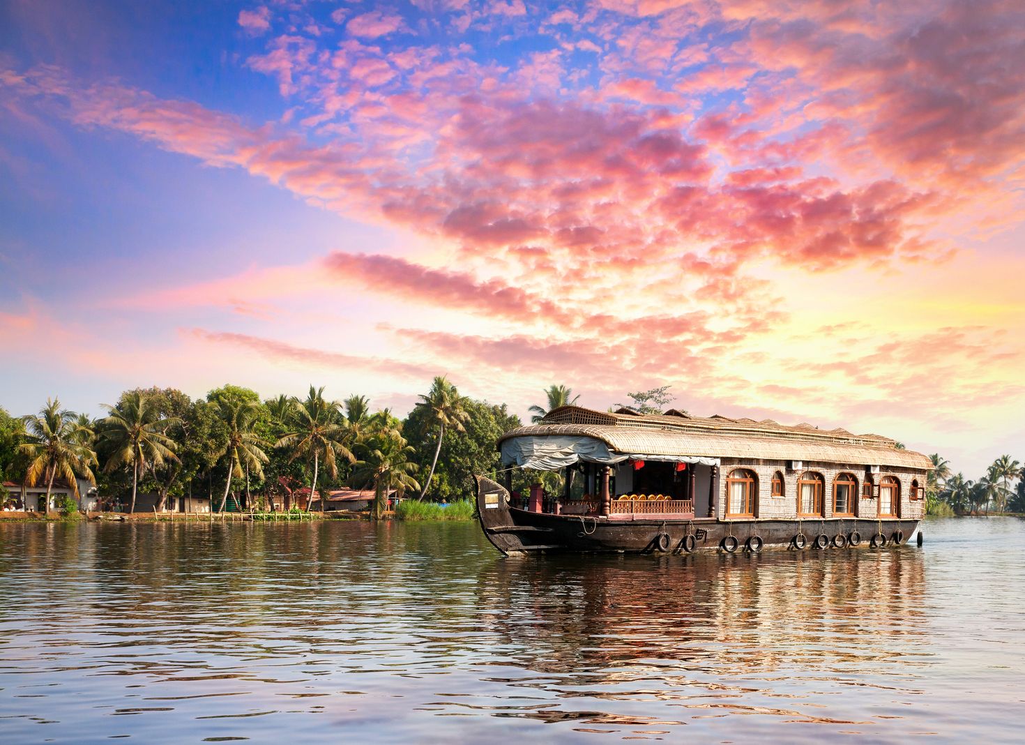 Take a boat tour of the Kerala Backwaters while spending 10 days in India.