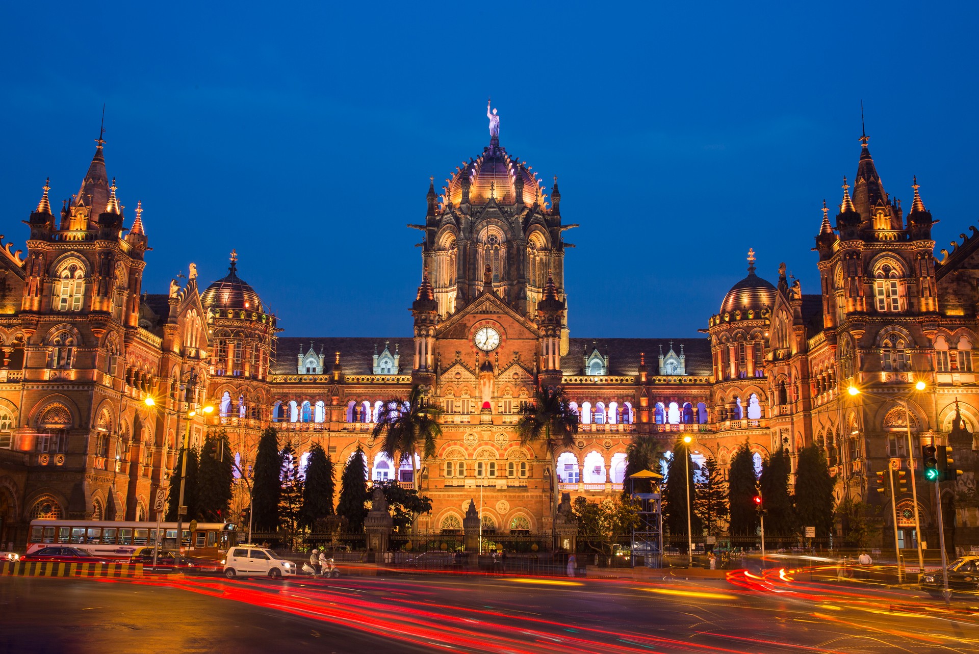 The grand architecture of Chhatrapati Shivaji Terminus lit up in the evening in Mumbai, India
