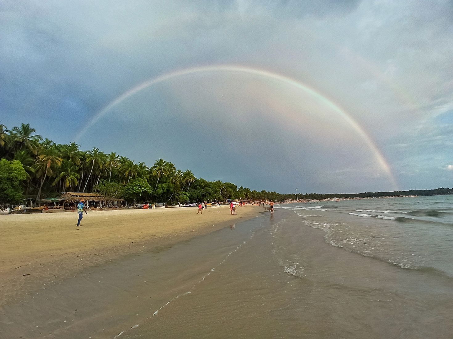 View of a rainbow over the beach in Goa, India in June