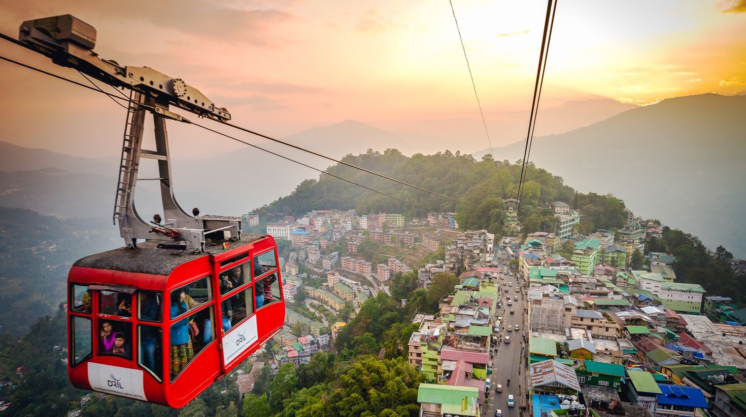 Aerial photo of Ropeway cable car over Gangtok city during sunset in Sikkim