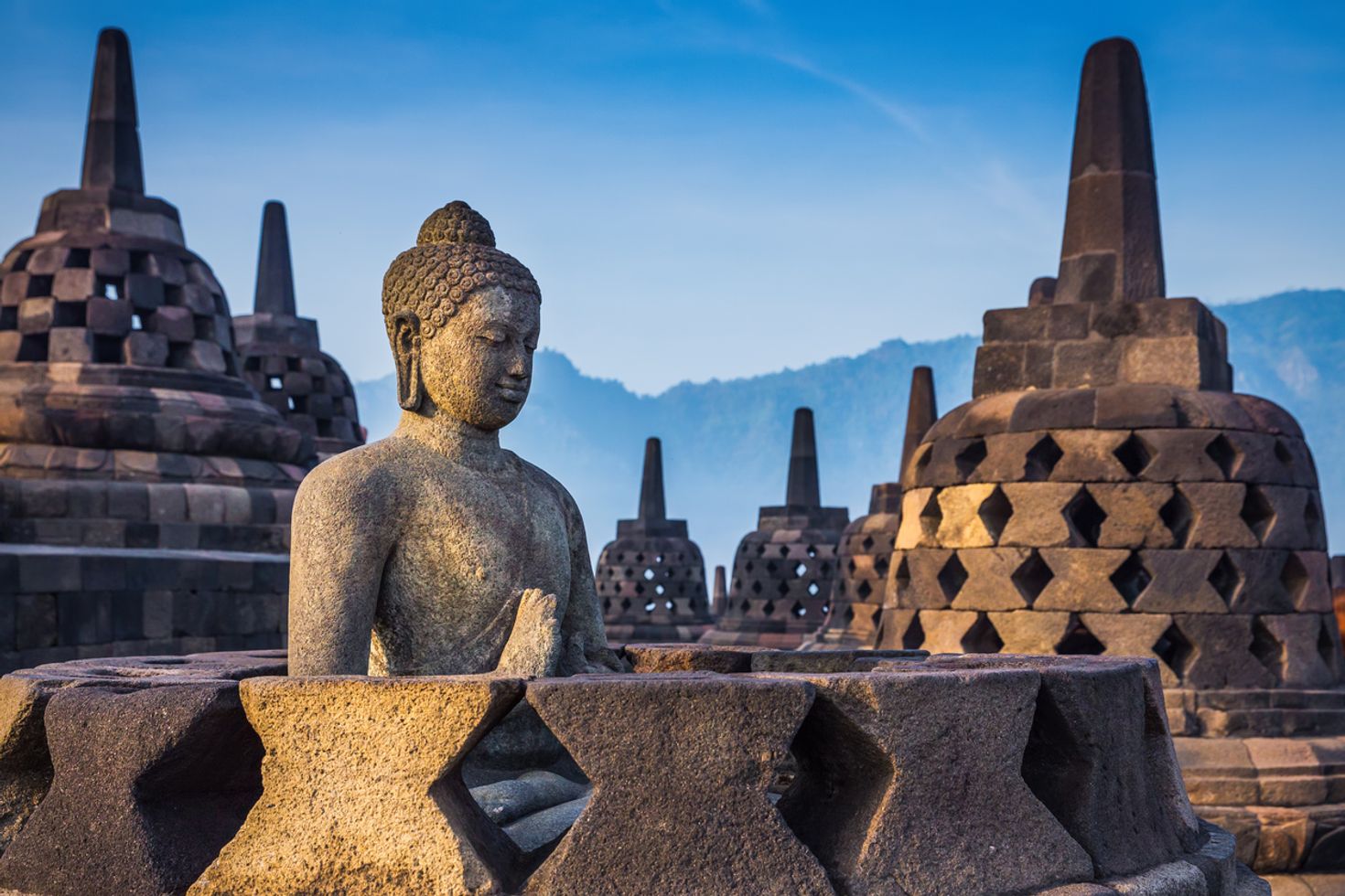 Borobudur, an Indonesian temple is popular for its open work stupas.