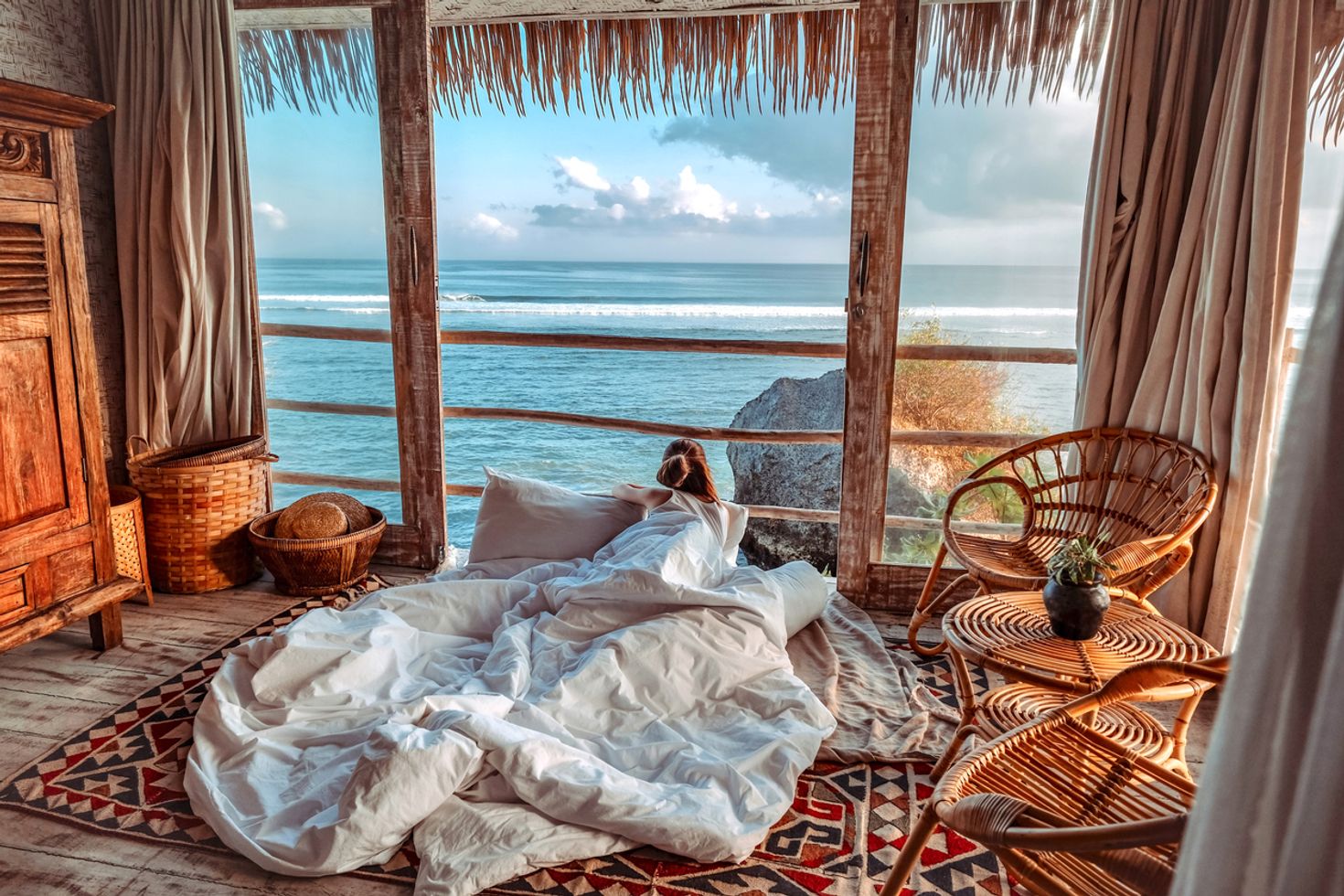 A woman relaxing in her hotel room in Bali, Indonesia in August