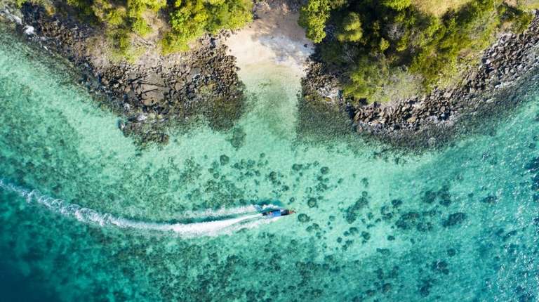 Bird's eye view of a long-tailed boat near Phi Phi Islands, Indonesia
