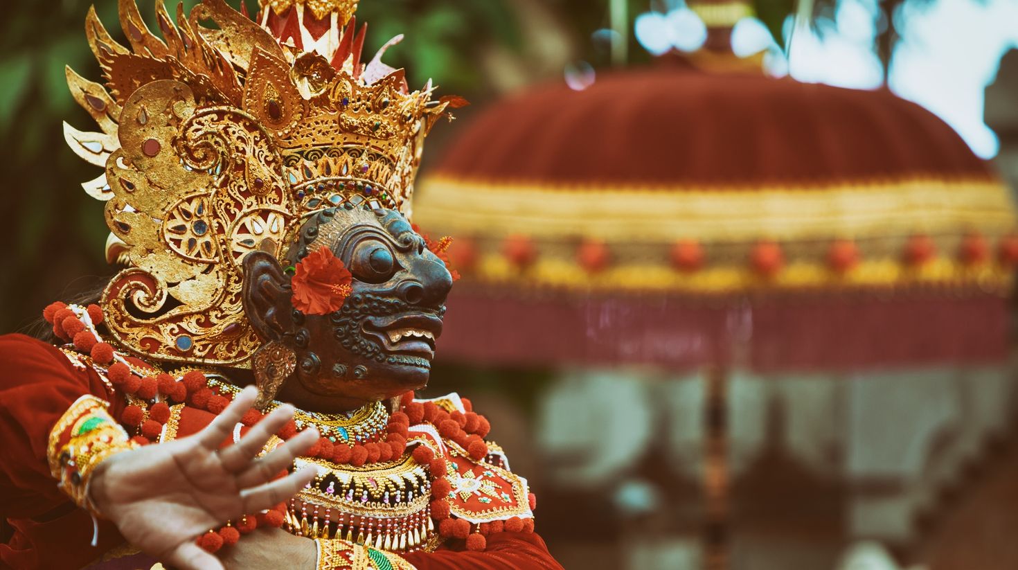 Dancer man in traditional costume of Indonesia performing during Denpasar.