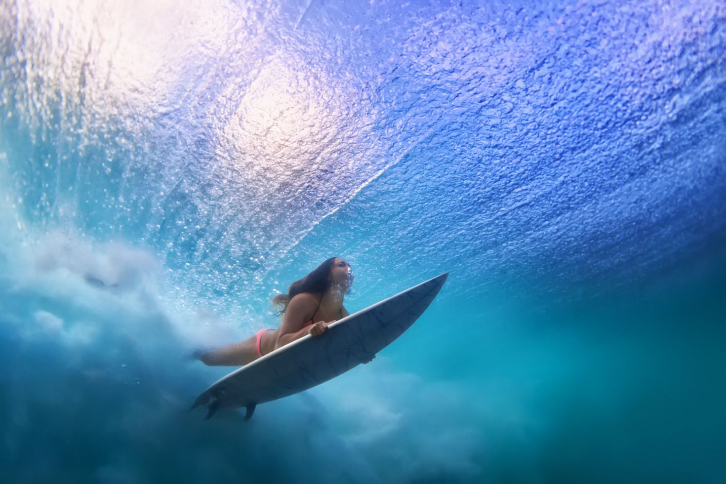 Girl attempting to surfing in Indonesia in June