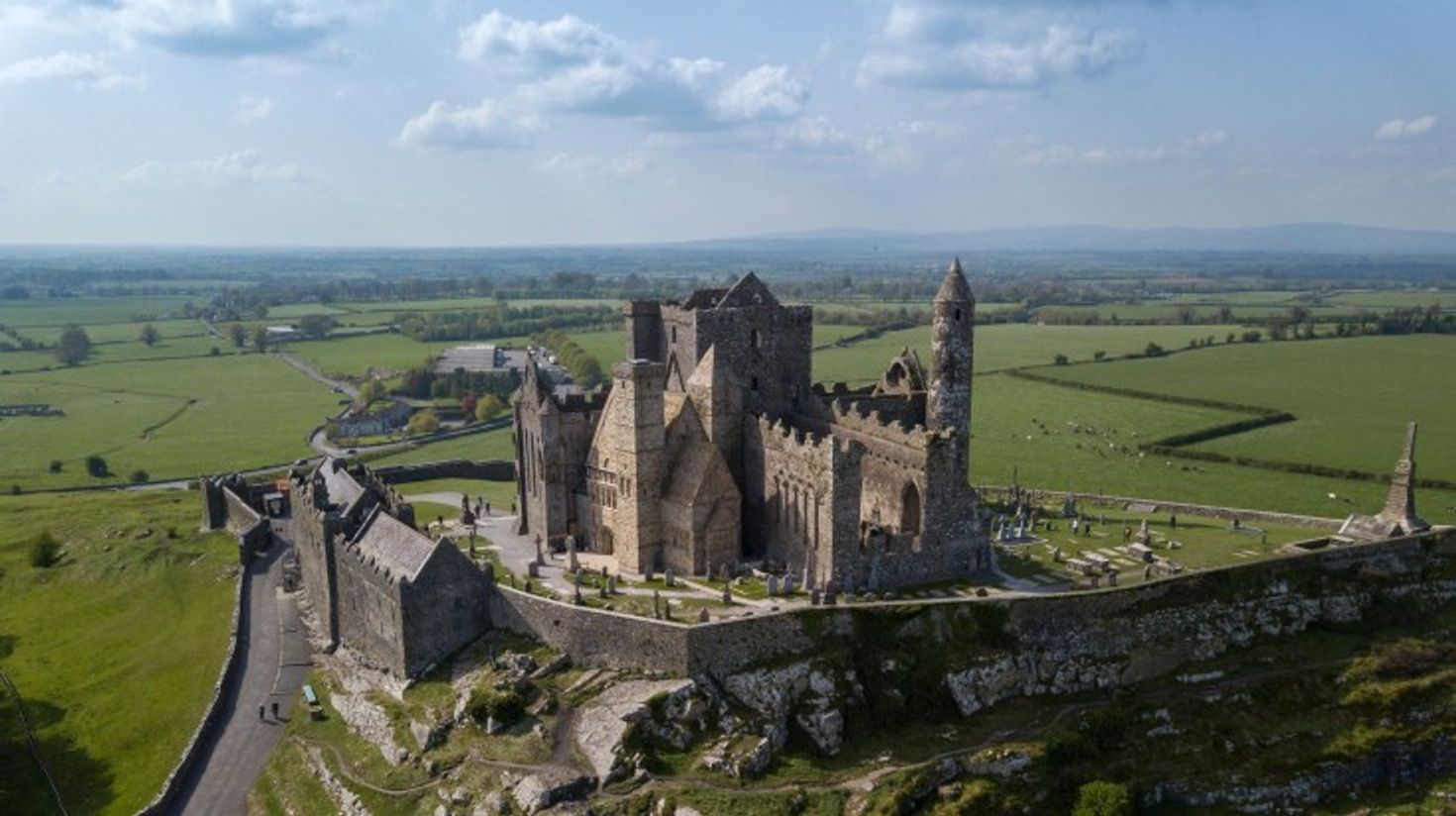 Aerial view of Rock of Cashel on a cloudy day in Ireland.