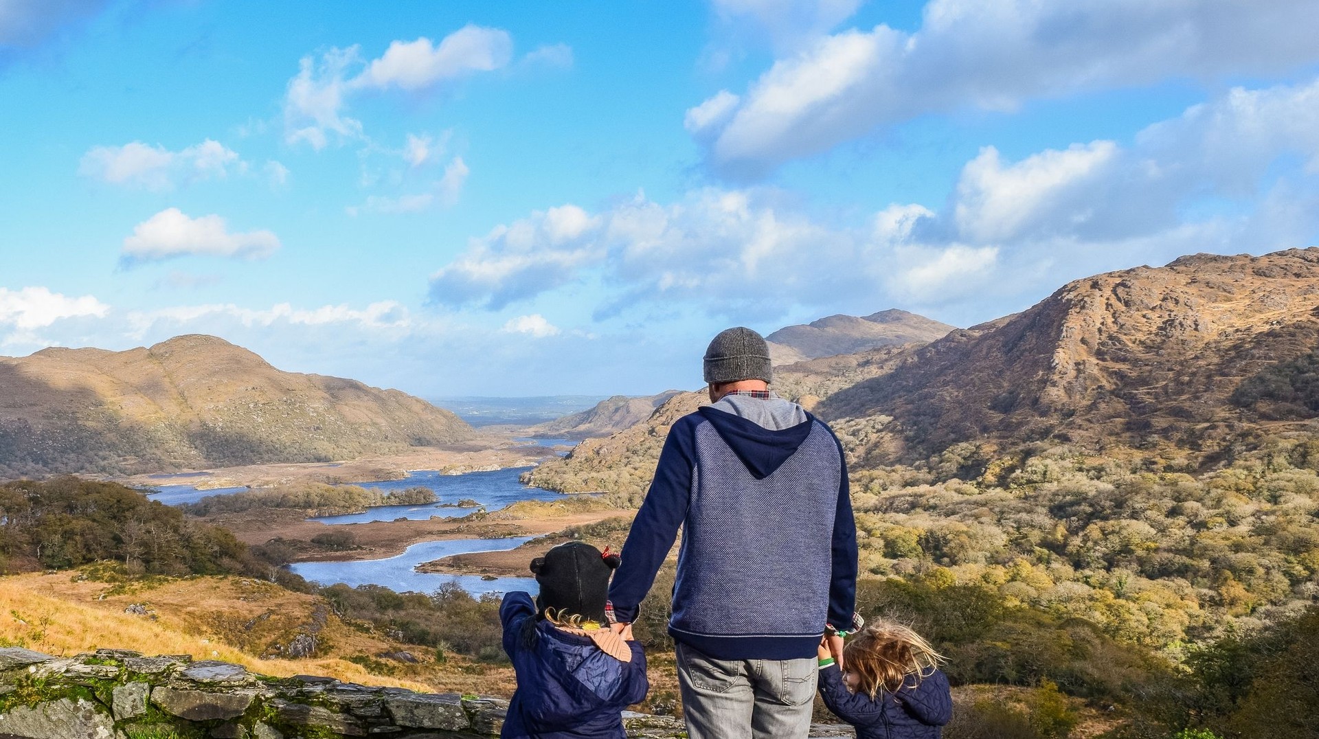 Experience the breathtaking beauty of the Ring of Kerry during your 4 days in Ireland, where stunning landscapes and charming villages create unforgettable memories. Father with two young children enjoying the scenic valley along the Ring of Kerry during their 4 days in Ireland.