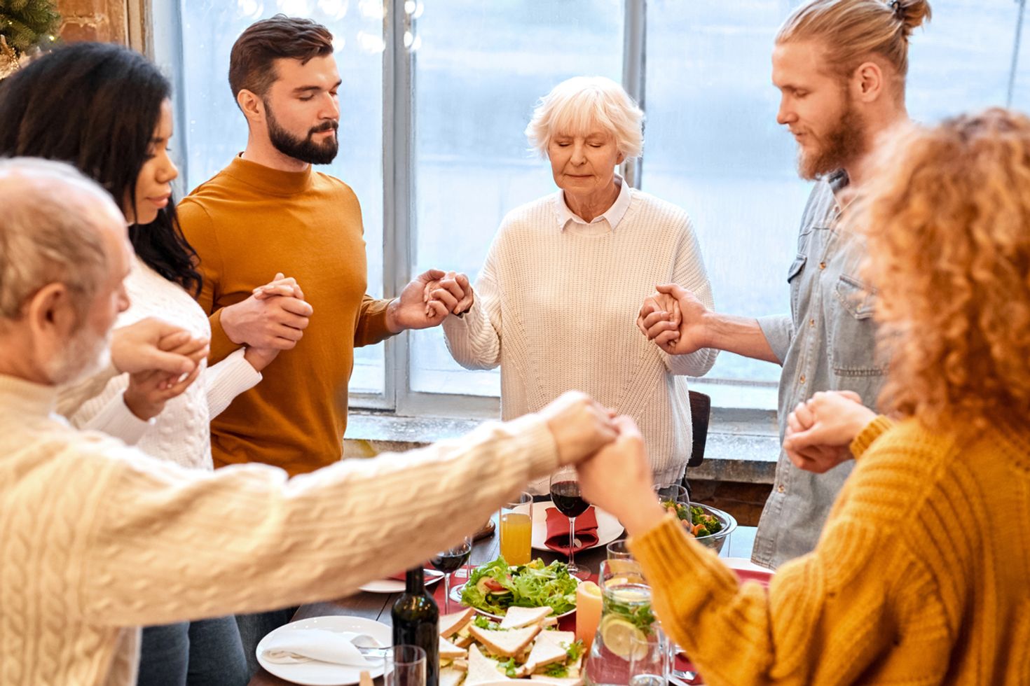 People praying before having their Easter dinner in Israel.
