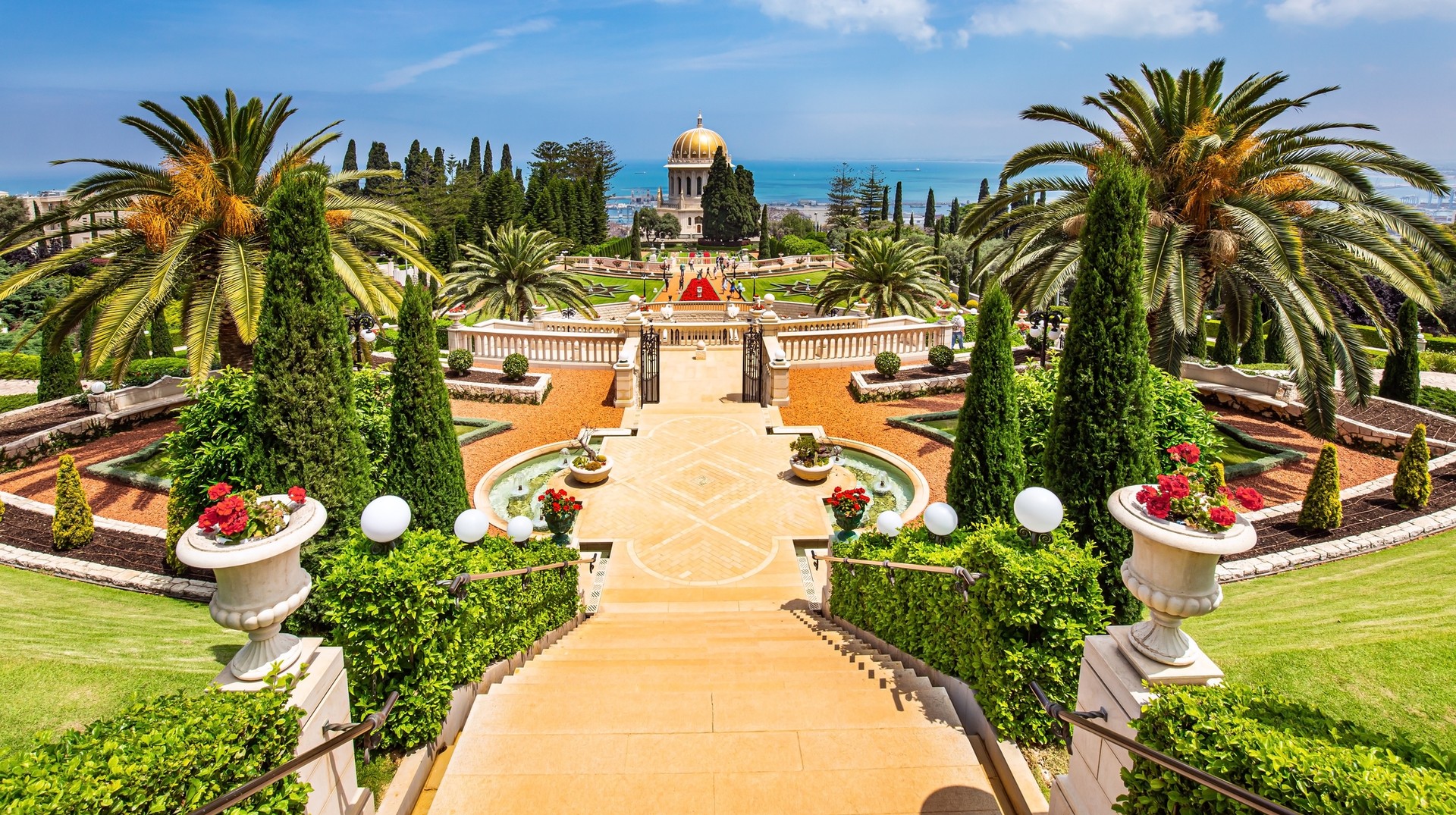 Add visiting to the Bahai World Center in Haifa when you travel to Israel in May. Magnificent colonnade with a gilded dome on Mount Carmel in Israel in May.