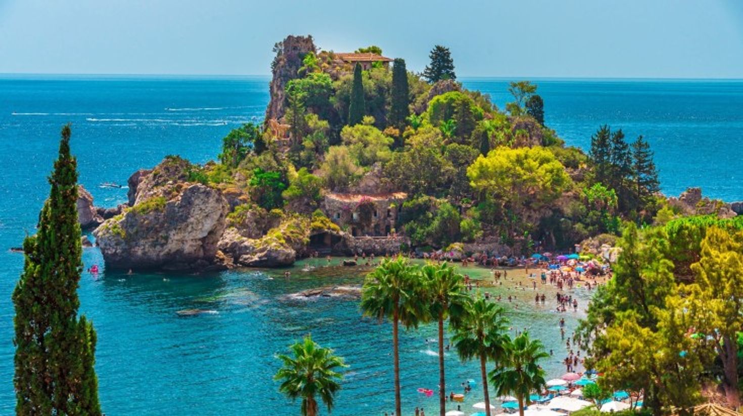 Aerial view of Isola Bella Beach on a clear summer day in Taormina.