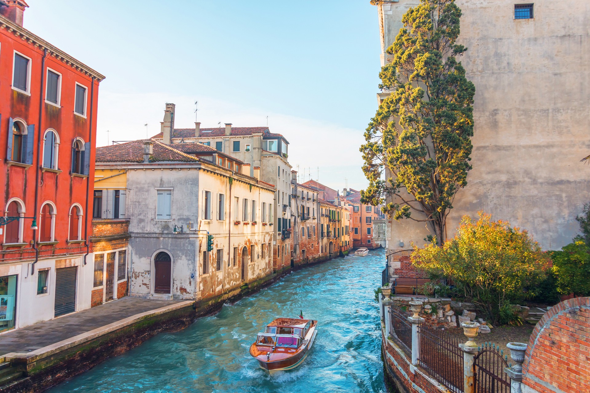 Boating in the cozy canals of Venice in Italy in August.
