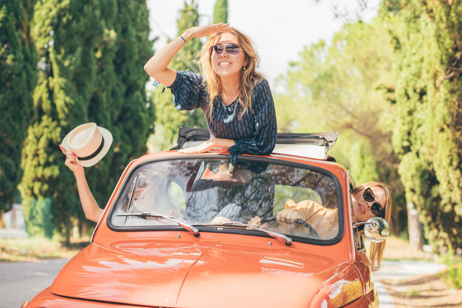 Three girls taking a road trip through Tuscany, Italy