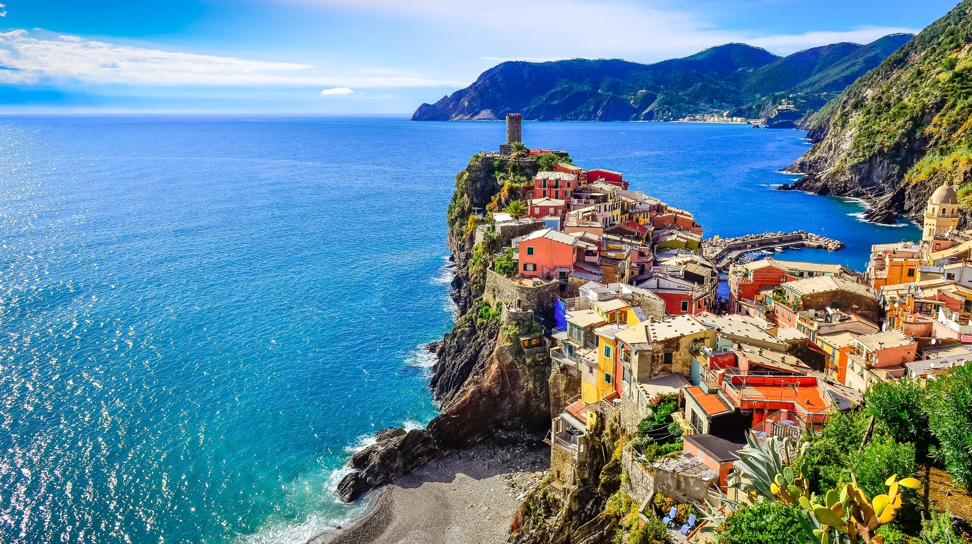 Experience the Mediterranean like never before from the coast of Cinque Terre in Italy during June. Scenic view of colorful village Vernessa and ocean coast in Cinque Terre of Italy in June.
