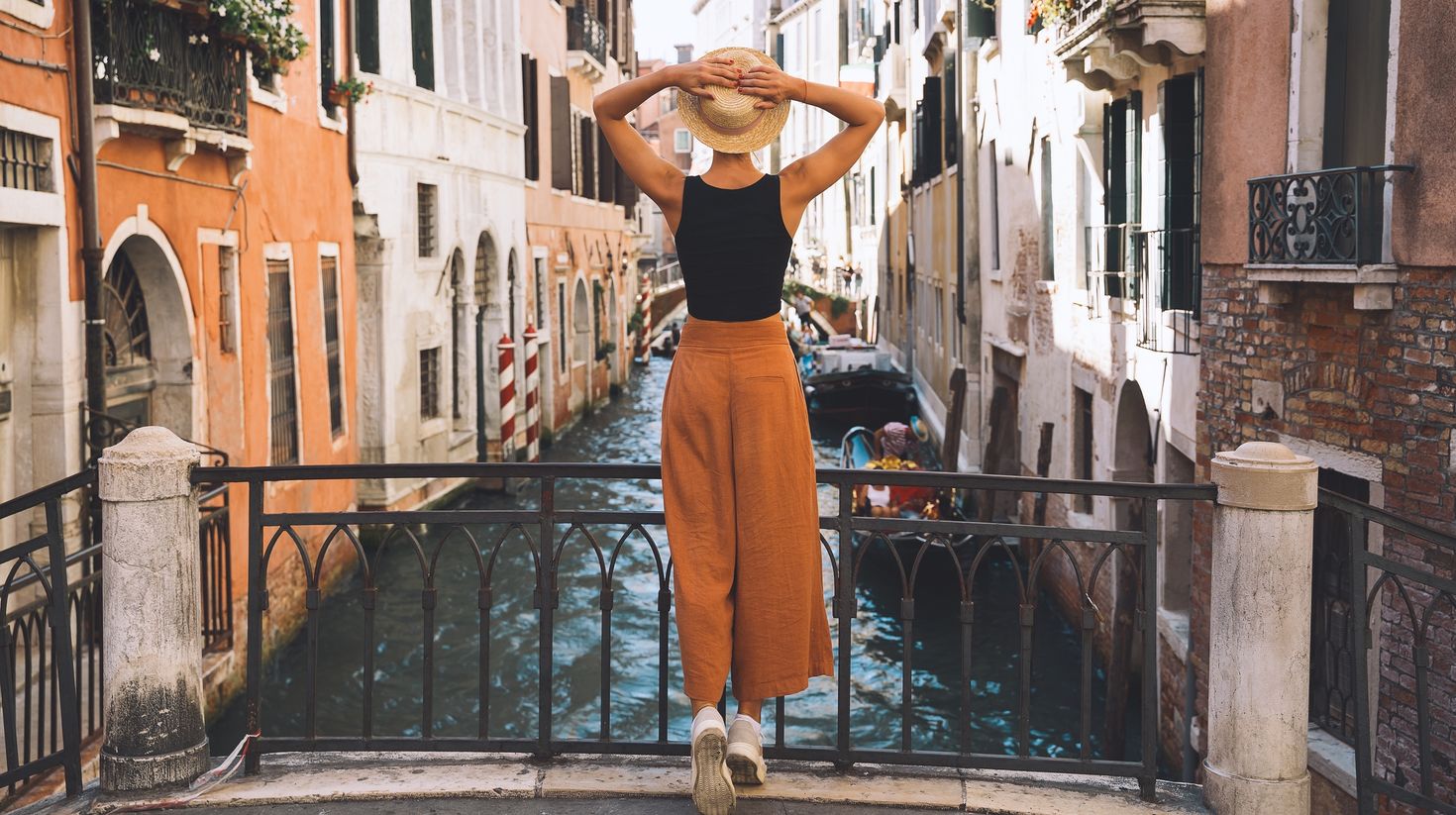 A young woman viewing the Venice canals in Italy