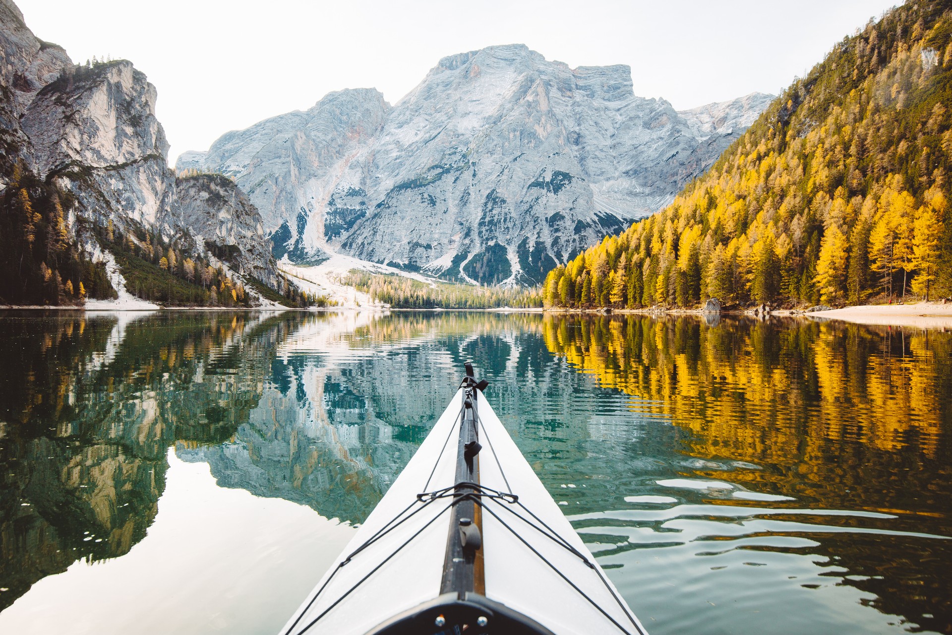 The view of Lago di Braies in the autumn foliage in Italy in November.