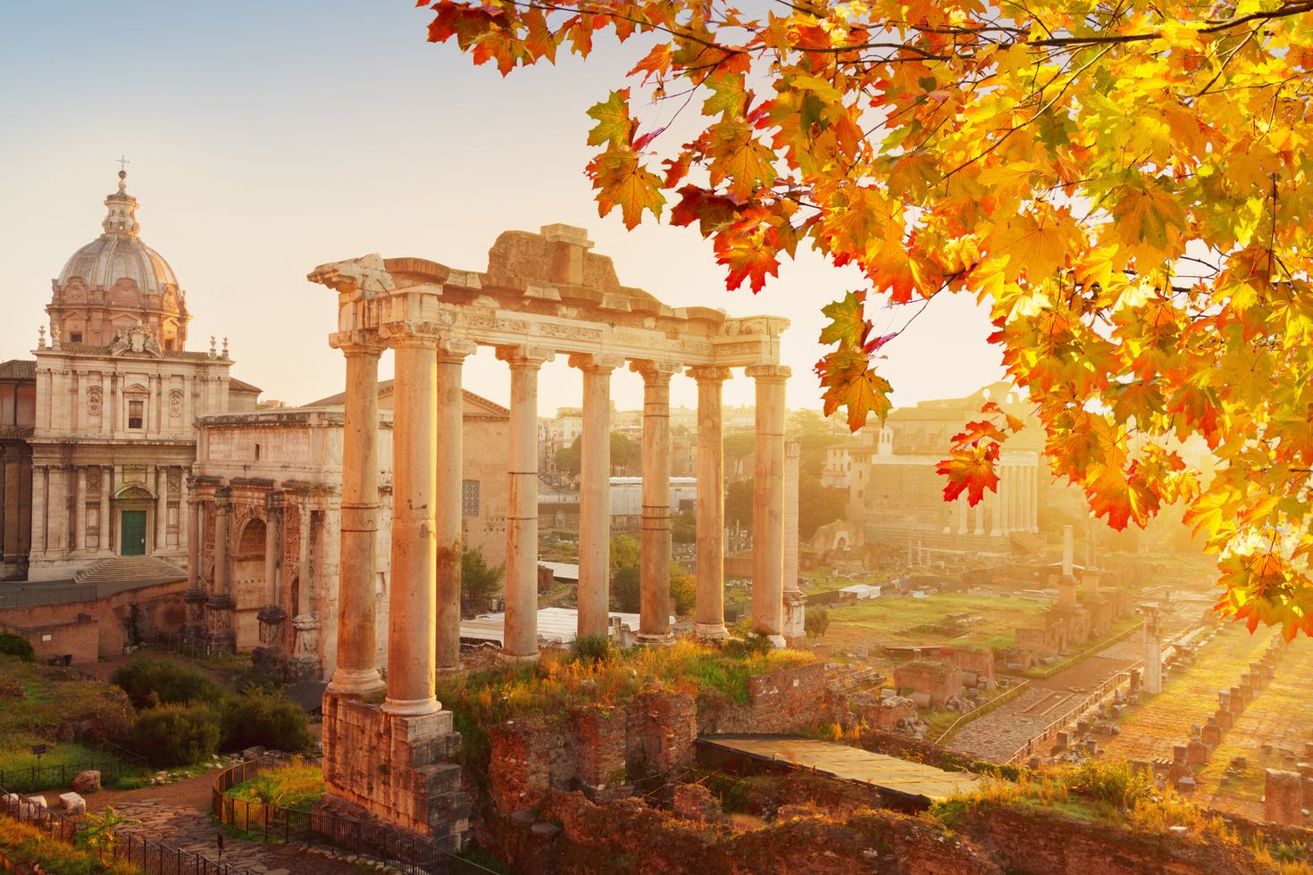 Roman ruins with cityscape of Rome with sunrire light at fall day