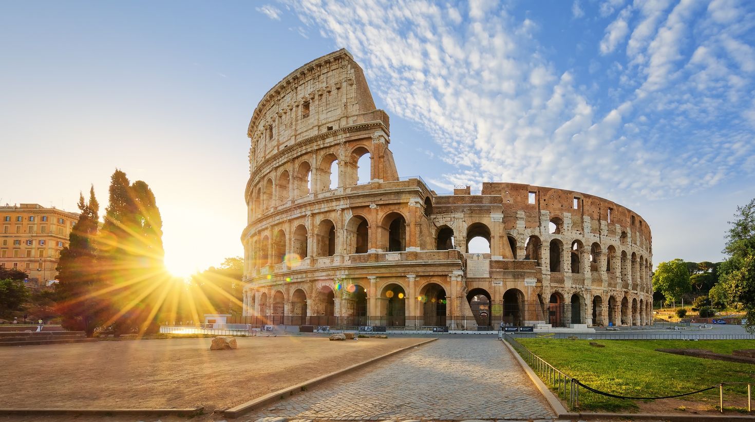 View of the Colosseum in Rome during sunrise.